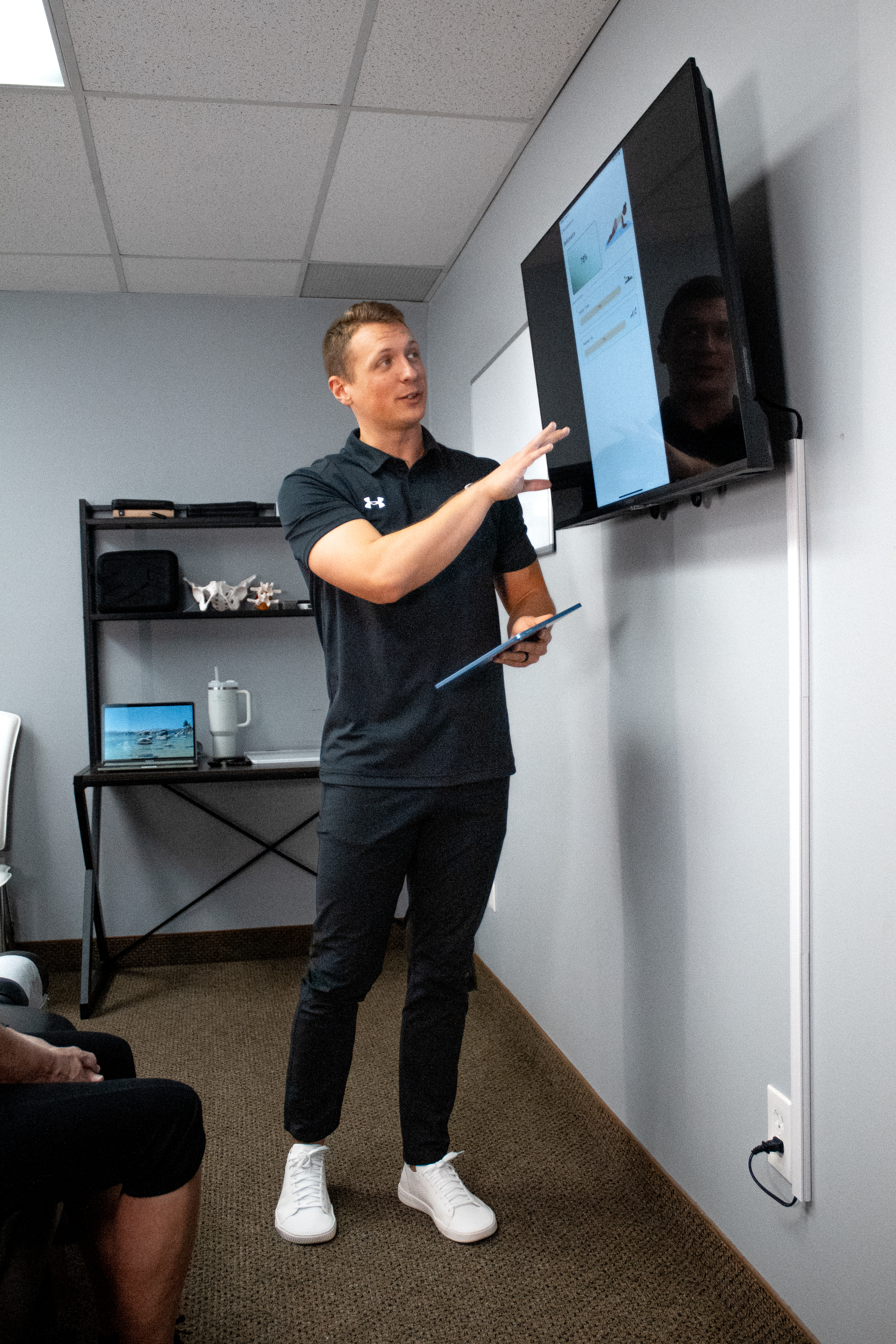 Dr. Mitch explaining assessment findings to a patient