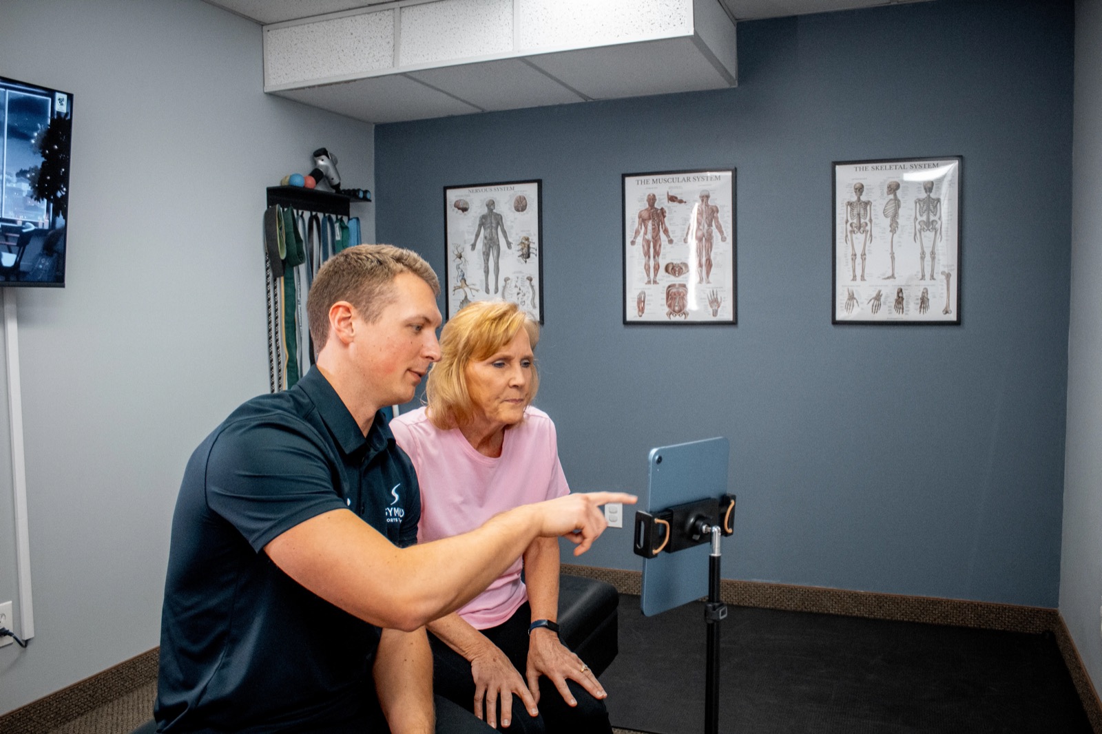 Dr. Mitch Israel reviewing Movement Age assessment findings with a patient